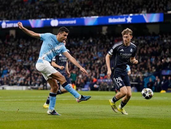 Manchester, England, 17th March 2026. Rodri of Manchester City shoots during the Manchester City vs Real Madrid UEFA Champions League round of 16 match at the Etihad Stadium, Manchester. Picture credit should read: Andrew Yates Sportimage EDITORIAL USE ONLY. No use with unauthorised audio, video, data, fixture lists, club league logos or live services. Online in-match use limited to 120 images, no video emulation. No use in betting, games or single club league player publications. SPI_016_AY_ManCity_Madrid SPI-4612-0028