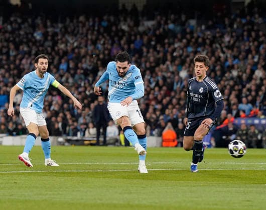 Manchester, England, 17th March 2026. Rayan Cherki of Manchester City shoots during the Manchester City vs Real Madrid UEFA Champions League round of 16 match at the Etihad Stadium, Manchester. Picture credit should read: Andrew Yates Sportimage EDITORIAL USE ONLY. No use with unauthorised audio, video, data, fixture lists, club league logos or live services. Online in-match use limited to 120 images, no video emulation. No use in betting, games or single club league player publications. SPI_017_AY_ManCity_Madrid SPI-4612-0024