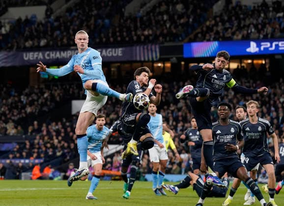 Manchester, England, 17th March 2026. Erling Haaland of Manchester City leaps up with Thiago Pitarch of Real Madrid during the Manchester City vs Real Madrid UEFA Champions League round of 16 match at the Etihad Stadium, Manchester. Picture credit should read: Andrew Yates Sportimage EDITORIAL USE ONLY. No use with unauthorised audio, video, data, fixture lists, club league logos or live services. Online in-match use limited to 120 images, no video emulation. No use in betting, games or single club league player publications. SPI_020_AY_ManCity_Madrid SPI-4612-0033