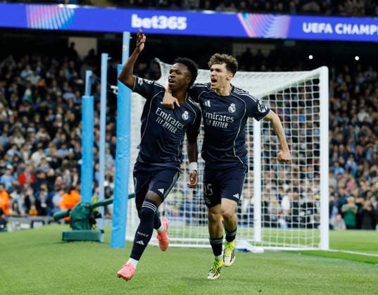 Manchester, England, 17th March 2026. Vinicius Junior of Real Madrid celebrates scoring the first goal from a penalty during the Manchester City vs Real Madrid UEFA Champions League round of 16 match at the Etihad Stadium, Manchester. Picture credit should read: Andrew Yates Sportimage EDITORIAL USE ONLY. No use with unauthorised audio, video, data, fixture lists, club league logos or live services. Online in-match use limited to 120 images, no video emulation. No use in betting, games or single club league player publications. SPI_019_CF_ManCity_Madrid SPI-4612-0044