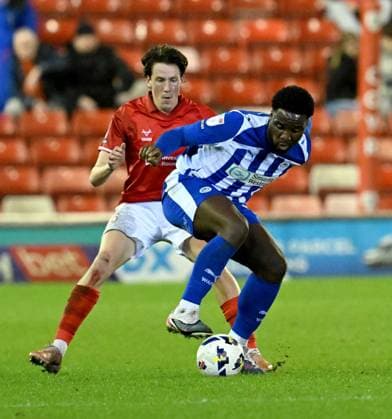 Christian Saydee of Wigan Athletic and Maël de Gevigney of Barnsley Barnsley v Wigan Athletic, Sky Bet League One, Football, Oakwell, Barnsley, UK - 17 Mar 2026Barnsley Oakwell United Kingdom EDITORIAL USE ONLY No use with unauthorised audio, video, data, fixture lists, club league logos or live services. Online in-match use limited to 120 images, no video emulation. No use in betting, games or single club league player publications. Copyright: xAnnaxGowthorpe Shutterstockx 16776372r