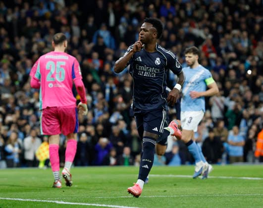 Manchester, England, 17th March 2026. Vinicius Junior of Real Madrid celebrates scoring the first goal from the penalty spot during the Manchester City vs Real Madrid UEFA Champions League round of 16 match at the Etihad Stadium, Manchester. Picture credit should read: Cody Froggatt Sportimage EDITORIAL USE ONLY. No use with unauthorised audio, video, data, fixture lists, club league logos or live services. Online in-match use limited to 120 images, no video emulation. No use in betting, games or single club league player publications. SPI_029_CF_ManCity_Madrid SPI-4612-0054