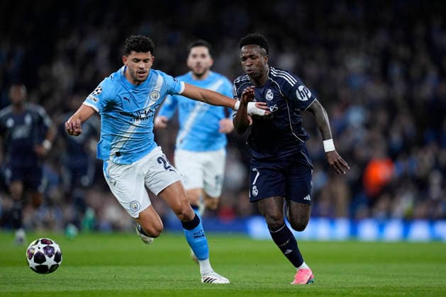 March 17, 2026, Manchester, Manchester, England: Vinicius Junior of Real Madrid CF and Matheus Nunes of Manchester City in action during the UEFA Champions League 2025 26 Round of 16 Second Leg match between Manchester City and Real Madrid C.F. at Etihad Stadium on March 17, 2026, in Manchester, England. Manchester England - ZUMAa181 20260317_zaa_a181_167 Copyright: xDennisxAgyemanx
