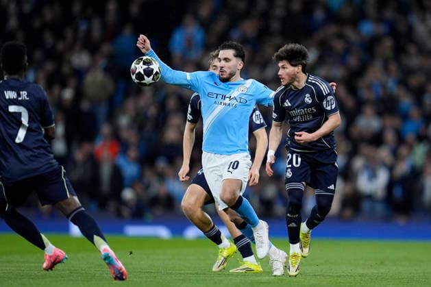 March 17, 2026, Manchester, Manchester, England: Rayan Cherki of Manchester City and Fran Garcia of Real Madrid CF in action during the UEFA Champions League 2025 26 Round of 16 Second Leg match between Manchester City and Real Madrid C.F. at Etihad Stadium on March 17, 2026, in Manchester, England. Manchester City V Real Madrid C.F. - UEFA Champions League 2025 26 Round Of 16 Second Leg  - ZUMAa181 20260317_zaa_a181_179 Copyright: xDennisxAgyemanx