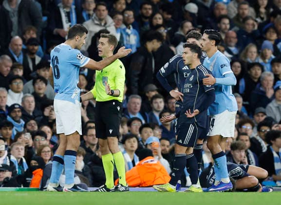 Manchester, England, 17th March 2026. Rodri of Manchester City talks to referee Clement Turpin during the Manchester City vs Real Madrid UEFA Champions League round of 16 match at the Etihad Stadium, Manchester. Picture credit should read: Cody Froggatt Sportimage EDITORIAL USE ONLY. No use with unauthorised audio, video, data, fixture lists, club league logos or live services. Online in-match use limited to 120 images, no video emulation. No use in betting, games or single club league player publications. SPI_038_CF_ManCity_Madrid SPI-4612-0079