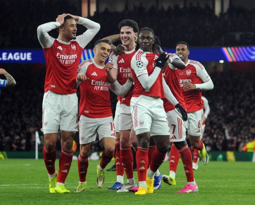 Football - 2025 2026 UEFA Champions League - Last Sixteen, Second Leg - Arsenal vs. Bayer Leverkusen - The Emirates Stadium - Tuesday 17th March 2026 Eberechi Eze of Arsenal celebrates his first half goal with team mates COLORSPORT ANDREW COWIE 