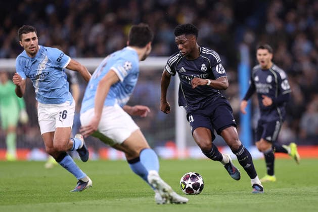 Manchester City v Real Madrid - UEFA Champions League MANCHESTER, UNITED KINGDOM - MARCH 17: Aurelien Tchouameni of Real Madrid runs with the ball whilst under pressure from Rodri of Manchester City during the UEFA Champions League Round of 16 Second Leg match between Manchester City and Real Madrid CF at City of Manchester Stadium on March 17, 2026 in Manchester, United Kingdom. Alex Livesey Anadolu Manchester United, ManU Kingdom. Editorial use only. Please get in touch for any other usage.  Copyright: x2026xAnadoluxAlexxLiveseyx