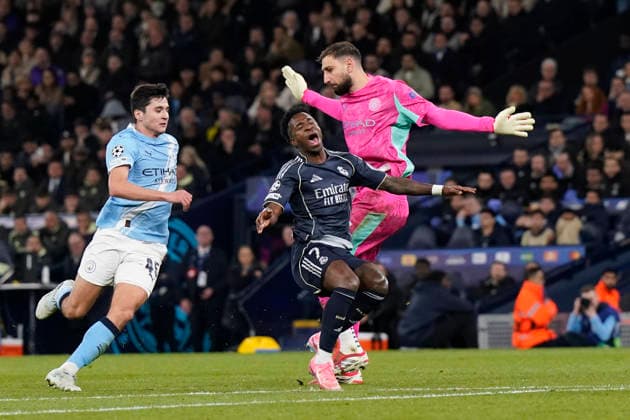 Manchester, England, 17th March 2026. Vinicius Junior of Real Madrid pretends to get fouled by Gianluigi Donnarumma of Manchester City during the Manchester City vs Real Madrid UEFA Champions League round of 16 match at the Etihad Stadium, Manchester. Picture credit should read: Andrew Yates Sportimage EDITORIAL USE ONLY. No use with unauthorised audio, video, data, fixture lists, club league logos or live services. Online in-match use limited to 120 images, no video emulation. No use in betting, games or single club league player publications. SPI_052_AY_ManCity_Madrid SPI-4612-0097
