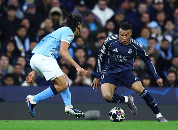 Kylian Mbappe of Real Madrid and Nathan Ake of Manchester City Manchester City v Real Madrid, UEFA Champions League, Round of 16, Second Leg, Football, Etihad Stadium, Manchester, UK - 17 Mar 2026Manchester Etihad Stadium United Kingdom EDITORIAL USE ONLY No use with unauthorised audio, video, data, fixture lists, club league logos or live services. Online in-match use limited to 120 images, no video emulation. No use in betting, games or single club league player publications.  Copyright: xMattxWest Shutterstockx 16776379bb