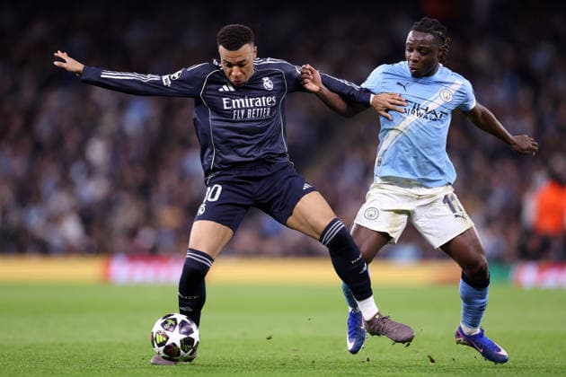 Manchester City v Real Madrid - UEFA Champions League MANCHESTER, UNITED KINGDOM - MARCH 17: Kylian Mbappe of Real Madrid is challenged by Jeremy Doku of Manchester City during the UEFA Champions League Round of 16 Second Leg match between Manchester City and Real Madrid CF at City of Manchester Stadium on March 17, 2026 in Manchester, United Kingdom. Alex Livesey Anadolu Manchester United, ManU Kingdom. Editorial use only. Please get in touch for any other usage.  Copyright: x2026xAnadoluxAlexxLiveseyx