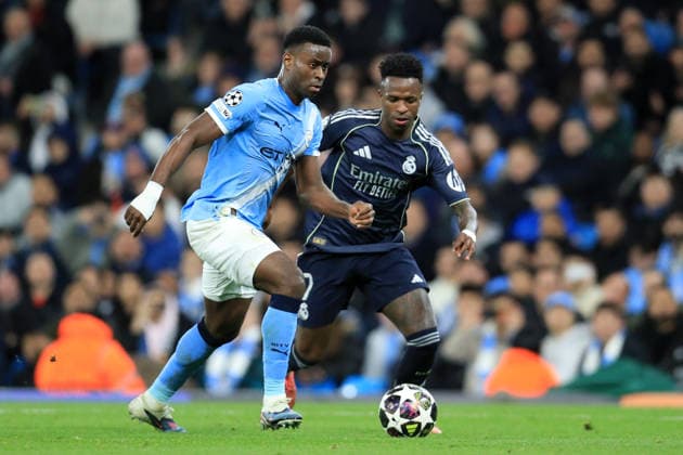 17th March 2026; Etihad Stadium, Manchester, England; UEFA Champions League Football, Manchester City versus Real Madrid; Marc Guehi of Manchester City is challenged by Vinicius Junior of Real Madrid  DavidxBlunsden Content restricted for UK based newspaper