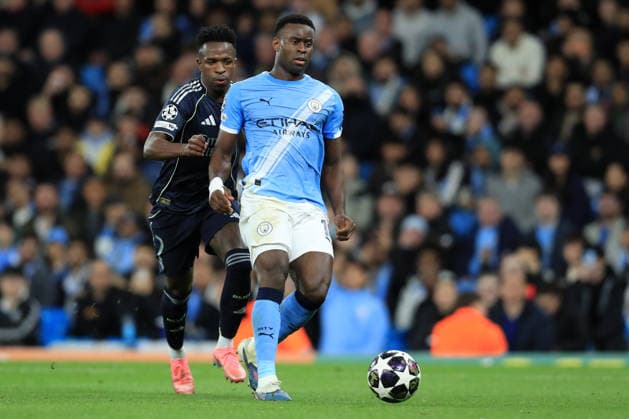 17th March 2026; Etihad Stadium, Manchester, England; UEFA Champions League Football, Manchester City versus Real Madrid; Marc Guehi of Manchester City shields the ball from Vinicius Junior of Real Madrid  DavidxBlunsden Content restricted for UK based newspaper