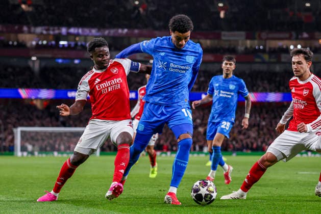 LONDON, ENGLAND - MARCH 17: Malik Tillman of Bayer 04 Leverkusen and Bukayo Saka of Arsenal battle for the ball during the UEFA Champions League 2025 26 Round of 16 Second Leg match between Arsenal FC and Bayer 04 Leverkusen at Arsenal Stadium on March 17, 2026 in London, England.  Copyright: xRenexNijhuis MBxMediax