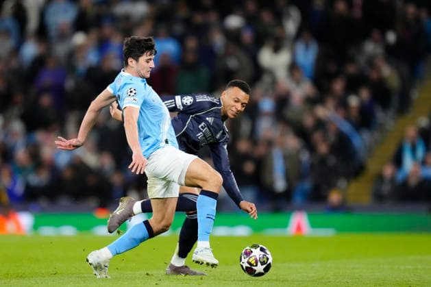 Manchester City FC v Real Madrid CF - UEFA Champions League 2025 26 Round of 16 Second Leg Abdukodir Khusanov centre-back of Manchester City and Uzbekistan and Kylian Mbappe centre-forward of Real Madrid and France compete for the ball during the UEFA Champions League 2025 26 Round of 16 Second Leg match between Manchester City FC and Real Madrid CF at City of Manchester Stadium on March 17, 2026 in Manchester, United Kingdom. Manchester England United Kingdom  Copyright: xJosexBretonx originalFilename:bretonhernandez-manchest260317_npvbK.jpg