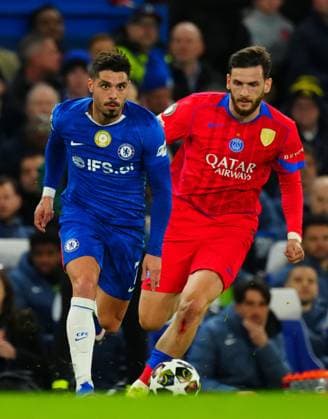 Khvicha Kvaratskhelia of PSG chases Pedro Neto of Chelsea Chelsea v Paris Saint-Germain, UEFA Champions League, Round of 16, Second Leg, Football, Stamford Bridge, London, UK - 17 Mar 2026London Stamford Bridge United Kingdom EDITORIAL USE ONLY No use with unauthorised audio, video, data, fixture lists, club league logos or live services. Online in-match use limited to 120 images, no video emulation. No use in betting, games or single club league player publications.  Copyright: xJavierxGarcia Shutterstockx 16776377by