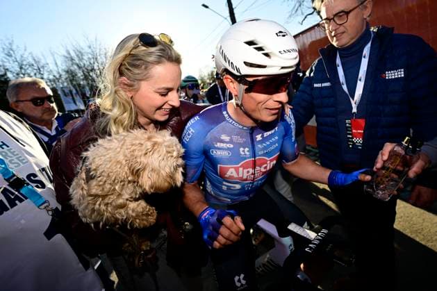 Danilith Nokere Koerse 2026 Cycling Race NOKERE, BELGIUM - MARCH 18 : Philipsen Jasper (BEL) of Alpecin Premier Tech with his girlfriend Melanie and dog Lulu during the 79th edition of Danilith Nokere Koerse an UCI ProSeries 1.Pro one day cycling road race for Men Elite of km with start in Deinze and finish in Nokere on March 18, 2026 in Nokere, Belgium, 18 03 2026 ( Motordriver Danilith Nokere Koerse Cycling Race - Nokere Belgium  Copyright: xJanxDexMeuleneirx