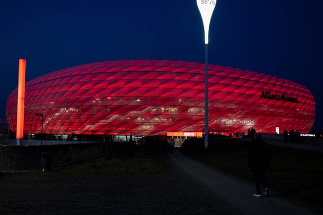 Allianz Arena from outside, illuminated in red, FC Bayern Muenchen vs Atalanta Bergamo, Football, UEFA Champions League, Round of 16 second leg, 18 03 2026 DFB regulations prohibit any use of photographs as image sequences and or quasi video Muenchen Bayern Germany Copyright: xkolbert-press UlrichxGamelx