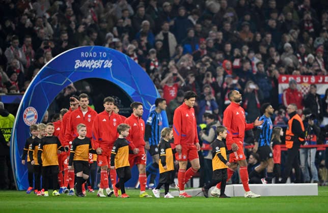 before the start of the match FC Bayern Muenchen players enter the pitch with ball children through Arch Bogen Road to Budapest FC Bayern Muenchen FCB vs Atalanta Bergamo CL Champions League Round of 16 second leg 18 03 2026 DFL REGULATIONS PROHIBIT ANY USE OF PHOTOGRAPHS AS IMAGE SEQUENCES AND OR QUASI VIDEO FC Bayern Muenchen FCB vs Atalanta Bergamo