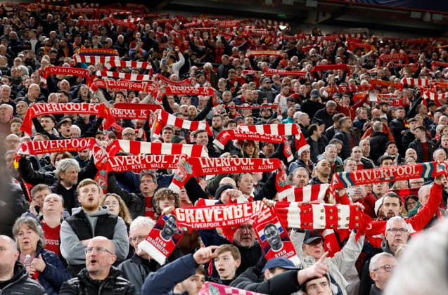Liverpool, England, 18th March 2026. Liverpool fans hold up scarves during the Liverpool vs Galatasaray UEFA Champions League round of 16 match at Anfield, Liverpool. Picture credit should read: Cody Froggatt Sportimage EDITORIAL USE ONLY. No use with unauthorised audio, video, data, fixture lists, club league logos or live services. Online in-match use limited to 120 images, no video emulation. No use in betting, games or single club league player publications. SPI_017_CF_Liverpool_Galatasaray SPI-4618-0017