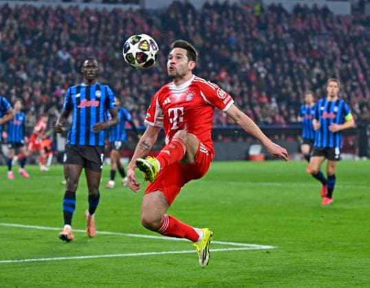 18 03 2026, Football UEFA Championsleague 2025 2026 Round of 16 second leg, FC Bayern Munich Atalanta Bergamo, in the Allianz Arena Munich, Raphael Guerreiro FC Bayern Munich on the ball DFL and DFB regulations prohibit any use of photographs as image sequences and or quasi video