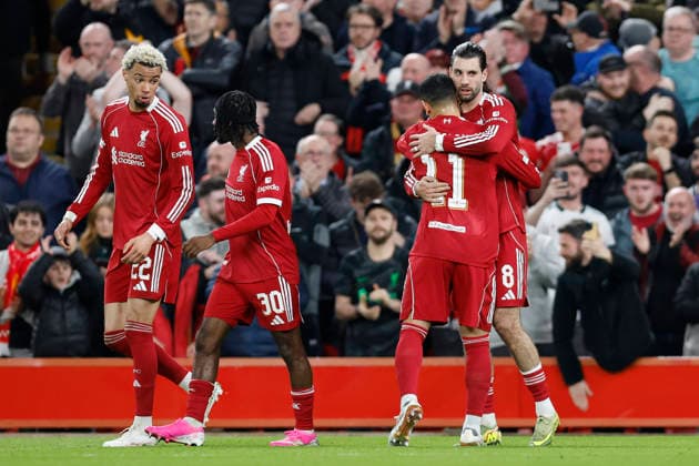 Liverpool, England, 18th March 2026. Dominik Szoboszlai (R) of Liverpool celebrates after scoring to make it 1-0 during the Liverpool vs Galatasaray UEFA Champions League round of 16 match at Anfield, Liverpool. Picture credit should read: Cody Froggatt Sportimage EDITORIAL USE ONLY. No use with unauthorised audio, video, data, fixture lists, club league logos or live services. Online in-match use limited to 120 images, no video emulation. No use in betting, games or single club league player publications. SPI_038_CF_Liverpool_Galatasaray SPI-4618-0038