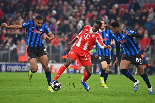 Nicolas JACKSON Bayern Muenchen , action,duel against Isak Hien Atalanta,left and Honest Ahanor Atalanta Football Champions League,season 2025 26, round of 16 FC Bayern Muenchen Atalanta Bergamo 4 1 on 18 03 2026 A L L I A N Z A R E N A