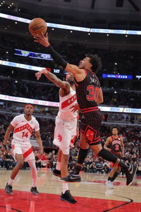 CHICAGO, IL - MARCH 18: Tre Jones 30 of the Chicago Bulls drives to the basket for a layup against Brandon Ingram 3 of the Toronto Raptors during the first half on March 18, 2026 at the United Center in Chicago, Illinois. (Photo by Melissa Tamez Icon Sportswire) NBA, Basketball Herren, USA MAR 18 Toronto Raptors at Chicago Bulls EDITORIAL USE ONLY Icon260318012