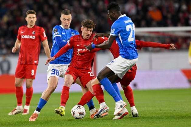Freiburg v KRC Genk - UEFA Europa League FREIBURG, GERMANY - MARCH 19 : Heymans Daan midfielder of KRC Genk, Philipp Treu defender of Freiburg and Bangoura Sory Ibrahima midfielder of KRC Genk during the UEFA Europa League 2025 26 round of 16 match second leg between Freiburg and KRC Genk on March 19, 2026 in Freiburg, Germany, 19 03 2026 Freiburg Germany  Copyright: xDhax