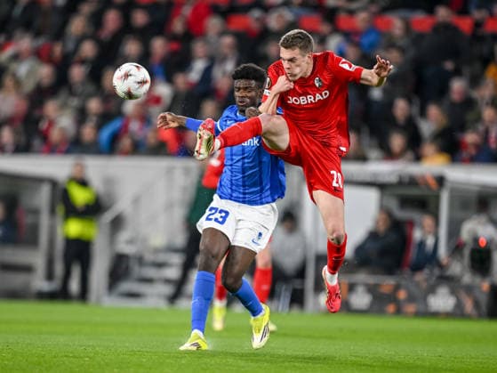 Aaron Bibout KRC Genk and Matthias Ginter SC Freiburg battle for the ball during the UEFA Europa League 2025 26 Round of 16 Second Leg match between SC Freiburg and KRC Genk at Stadion am Wolfswinkel on March 19, 2026 in Freiburg im Breisgau, Germany Photo by Harry Langer DeFodi Images