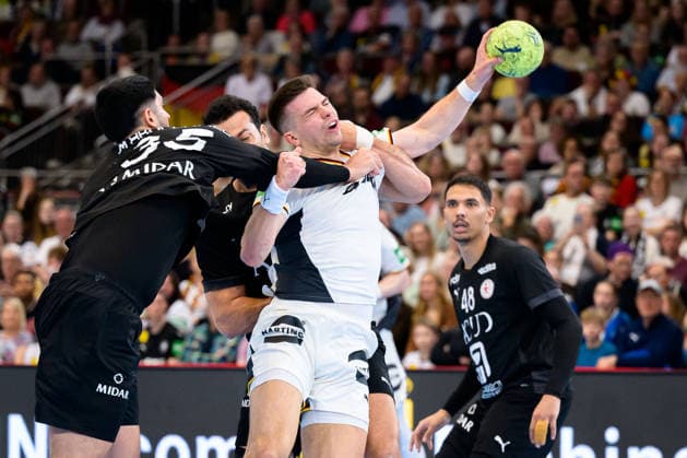 Dortmund international handball match Germany Egypt v left in a duel Mahmoud Abdelaziz Egypt and Renars Uscins Germany Dortmund Westfalenhalle North Rhine-Westphalia Germany
