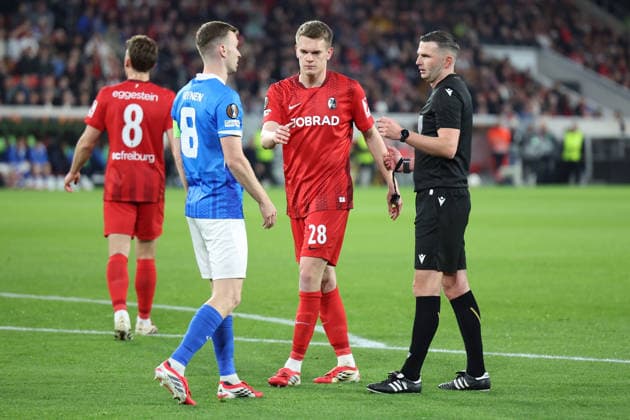 19 03 2026, xrekx, Football UEFA Europa League, SC Freiburg KRC Genk v l Bryan Heynen KRC Genk Matthias Ginter SC Freiburg Referee Referee Michael Oilver DFL DFB REGULATIONS PROHIBIT ANY USE OF PHOTOGRAPHS as IMAGE SEQUENCES and or QUASI VIDEO Freiburg