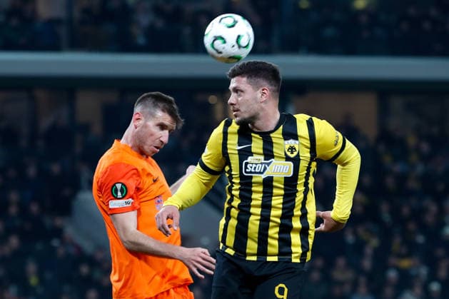 AEK Athens v NK Celje UEFA Europa League Luka Jovic of AEK Athens and Damjan Vuklisevic of NK Celje during the UEFA Europa League Round of 16 Second Leg match at Allwyn Arena, Athens 19 03 2026 UK Newspapers OUT Copyright: xYannisxHalasx FIL-23160-0029