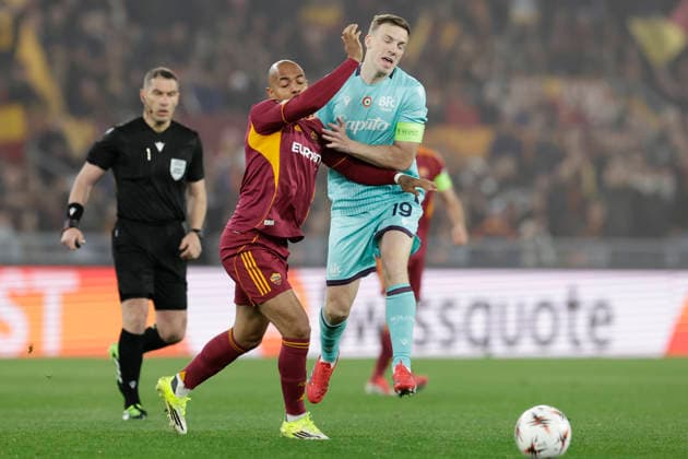 UEFA Europa League round of 16 second leg match AS Roma - Bologna Roma™s Dutch midfielder Donyell Malen challenges for the ball with Bologna s Scottish midfielder Lewis Ferguson during UEFA Europa League round of 16 second leg match AS Roma - Bologna at Olimpico stadium on March 19, 2026 in Rome, Italy. _BPH7167 Copyright: xAntonioxBalascox