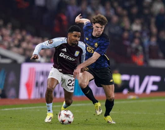 Birmingham, England, 19th March 2026. Ian Maatsen of Aston Villa tussles with Thomas Meunier of LOSC Lille during the Aston Villa vs LOSC Lille UEFA Europa League round of 16 match at Villa Park, Birmingham. Picture credit should read: Andrew Yates Sportimage EDITORIAL USE ONLY. No use with unauthorised audio, video, data, fixture lists, club league logos or live services. Online in-match use limited to 120 images, no video emulation. No use in betting, games or single club league player publications. SPI_032_AY_Villa_Lille SPI-4627-0032