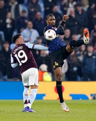 Birmingham, England, 19th March 2026. Jadon Sancho of Aston Villa tussles with Alexsandro of LOSC Lille during the Aston Villa vs LOSC Lille UEFA Europa League round of 16 match at Villa Park, Birmingham. Picture credit should read: Andrew Yates Sportimage EDITORIAL USE ONLY. No use with unauthorised audio, video, data, fixture lists, club league logos or live services. Online in-match use limited to 120 images, no video emulation. No use in betting, games or single club league player publications. SPI_035_AY_Villa_Lille SPI-4627-0035