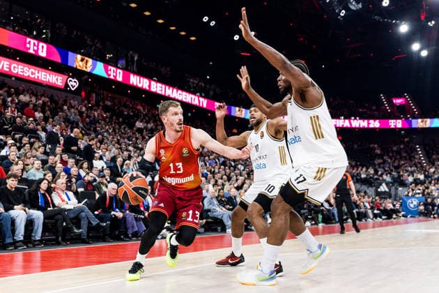 MUNICH, GERMANY - MARCH 19: Andreas Andi Obst (FC Bayern Muenchen, 13) controls the ball against Justin Anderson (Dubai Basketball, 10) and Mfiondu Kabengele (Dubai Basketball, 17) during the Turkish Airlines EuroLeague match between FC Bayern Muenchen vs.Dubai Basketball at SAP Garden on round 32 of Turkish Airlines EuroLeague on March 19, 2026 in Munich, Germany. Bavaria Germany Copyright: xSteffiexWunderlx
