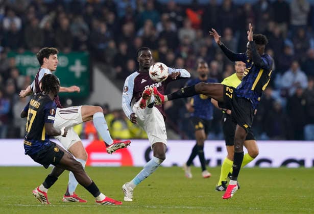 Birmingham, England, 19th March 2026. Amadou Onana of Aston Villa (c) tackled by Felix Correia of LOSC Lille (r) during the Aston Villa vs LOSC Lille UEFA Europa League round of 16 match at Villa Park, Birmingham. Picture credit should read: Andrew Yates Sportimage EDITORIAL USE ONLY. No use with unauthorised audio, video, data, fixture lists, club league logos or live services. Online in-match use limited to 120 images, no video emulation. No use in betting, games or single club league player publications. SPI_043_AY_Villa_Lille SPI-4627-0043