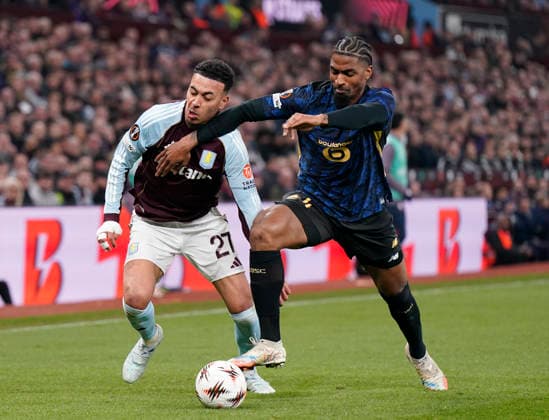 Birmingham, England, 19th March 2026. Morgan Rogers of Aston Villa tussles with Alexsandro of LOSC Lille during the Aston Villa vs LOSC Lille UEFA Europa League round of 16 match at Villa Park, Birmingham. Picture credit should read: Andrew Yates Sportimage EDITORIAL USE ONLY. No use with unauthorised audio, video, data, fixture lists, club league logos or live services. Online in-match use limited to 120 images, no video emulation. No use in betting, games or single club league player publications. SPI_062_AY_Villa_Lille SPI-4627-0062