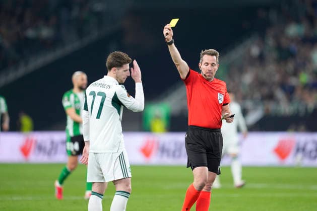 March 19, 2026, Sevilla, Sevilla, Spain: Georgios Kyriakopoulos of Panathinaikos FC see the yellow card during the UEFA Europa League 2025 26 Round of 16 Second Leg match between Real Betis Balompie and Panathinaikos FC at La Cartuja stadium on March 19, 2026, in Sevilla, Spain. Real Betis Balompie V Panathinaikos FC - UEFA Europa League  - ZUMAa181 20260319_zaa_a181_173 Copyright: xJoaquinxCorcherox