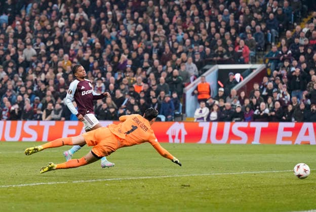 Birmingham, England, 19th March 2026. Leon Bailey of Aston Villa scores their second goal during the Aston Villa vs LOSC Lille UEFA Europa League round of 16 match at Villa Park, Birmingham. Picture credit should read: Andrew Yates Sportimage EDITORIAL USE ONLY. No use with unauthorised audio, video, data, fixture lists, club league logos or live services. Online in-match use limited to 120 images, no video emulation. No use in betting, games or single club league player publications. SPI_064_AY_Villa_Lille SPI-4627-0063
