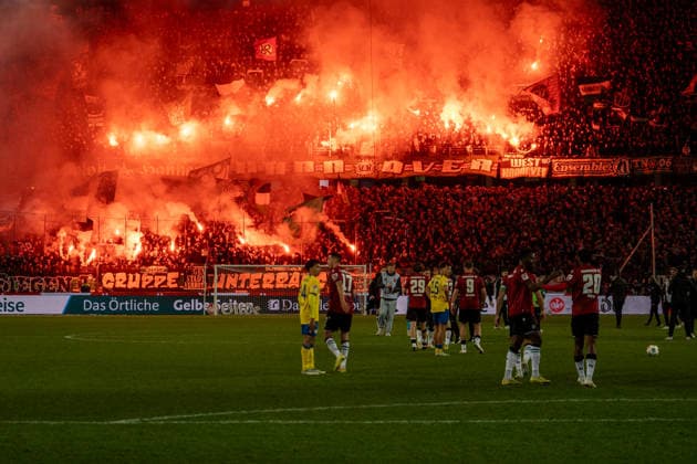 Germany Soccer 2 Bundesliga, 27 Matchday 2025 2026, Hannover 96 Eintracht Braunschweig on 20 03 in Hannover Heinz von Heiden Arena final whistle, pyro, pyrotechnics, fans, Ultras, Hannover, derby Copyright: xSvenxHeidmannx