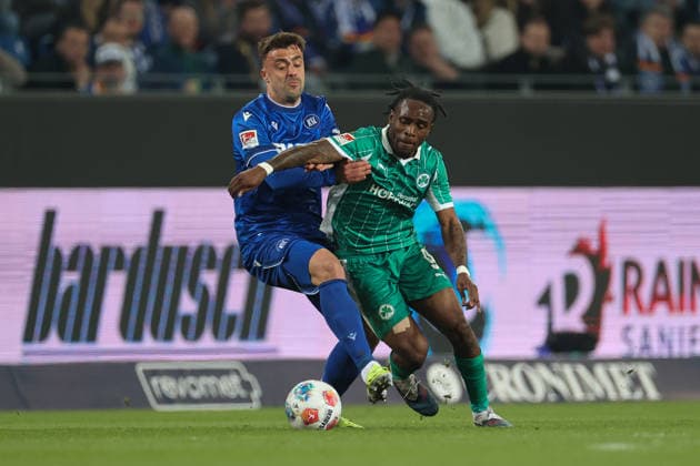 Philipp Foerster Karlsruher SC, 11 in duel with Noel Futkeu SpVgg Greuther Fuerth, 09 , Karlsruher SC vs SpVgg Greuther Fuerth, 2 Bundesliga, Matchday 27, 2025 2026, 20 03 2026, DFL REGULATIONS PROHIBIT ANY USE OF PHOTOGRAPHS AS IMAGE SEQUENCES AND OR QUASI VIDEO, Karlsruher SC vs SpVgg Greuther Fuerth, 2 Bundesliga, 27 Matchday, 2025 2026, 20 03 2026 Karlsruhe Copyright: xEibner-Pressefoto JanxPrihodax EP_JPA