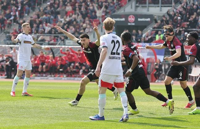 21 03 2026 Soccer Season 2025 2026 2 Soccer Bundesliga 27 Matchday 1 FC Nürnberg FCN Club 1 FC Kaiserslautern FCK Rote Roten Teufel Sportfoto Zink DaMa xdaxmax DFL regulations prohibit any use of photographs as image sequences and or quasi video only for editorial use Jubel Freude Torjubel nach Tor zum 1 0 Luka Lochoshvili 24, 1 FC Nürnberg FCN und Mannschaft Team jubelt freut sich Torschütze Luka Lochoshvili 24, 1 FC Nürnberg FCN