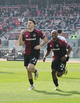21 03 2026 Soccer Season 2025 2026 2 Soccer Bundesliga 27 Matchday 1 FC Nürnberg FCN Club 1 FC Kaiserslautern FCK Rote Roten Teufel Sportfoto Zink DaMa xdaxmax DFL regulations prohibit any use of photographs as image sequences and or quasi video only for editorial use Jubel Freude Torjubel nach Tor zum 1 0 Luka Lochoshvili 24, 1 FC Nuremberg FCN Mohamed Ali Zoma 23, 1 FC Nuremberg FCN and team Team cheers happy Goalscorer Luka Lochoshvili 24, 1 FC Nuremberg FCN