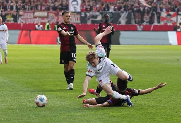 21 03 2026 Soccer Season 2025 2026 2 Soccer Bundesliga 27 Matchday 1 FC Nürnberg FCN Club 1 FC Kaiserslautern FCK Rote Roten Teufel Sportfoto Zink DaMa xdaxmax DFL regulations prohibit any use of photographs as image sequences and or quasi video only for editorial use Mika Haas 22, 1 FC Kaiserslautern FCK Henri Koudossou 8, 1 FC Nürnberg FCN