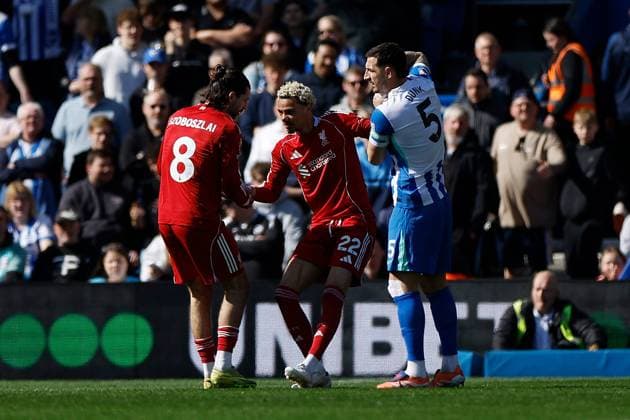 Hugo Ekitike of Liverpool is helped up by Dominik Szoboszlai of Liverpool and Lewis Dunk of Brighton and Hove Albion Brighton and Hove Albion v Liverpool, Premier League, Football, American Express Community Stadium, Brighton, UK - 21 Mar 2026Brighton American Express Community Stadi United Kingdom EDITORIAL USE ONLY No use with unauthorised audio, video, data, fixture lists, club league logos or live services. Online in-match use limited to 120 images, no video emulation. No use in betting, games or single club league player publications. Copyright: xWillxCooper Shutterstockx 16783233q