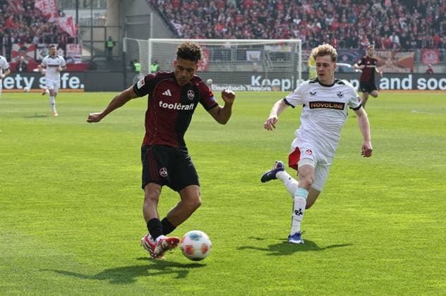 21 03 2026 Soccer Season 2025 2026 2 Soccer Bundesliga 27 Matchday 1 FC Nürnberg FCN Club 1 FC Kaiserslautern FCK Rote Roten Teufel Sportfoto Zink DaMa xdaxmax DFL regulations prohibit any use of photographs as image sequences and or quasi video only for editorial use Henri Koudossou 8, 1 FC Nürnberg FCN flankt Flanke