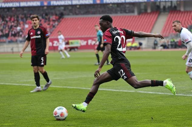 21 03 2026 Soccer Season 2025 2026 2 Soccer Bundesliga 27 Matchday 1 FC Nürnberg FCN Club 1 FC Kaiserslautern FCK Rote Roten Teufel Sportfoto Zink DaMa xdaxmax DFL regulations prohibit any use of photographs as image sequences and or quasi video only for editorial use Rabby Nzingoula 22, 1 FC Nürnberg FCN knocks ball down
