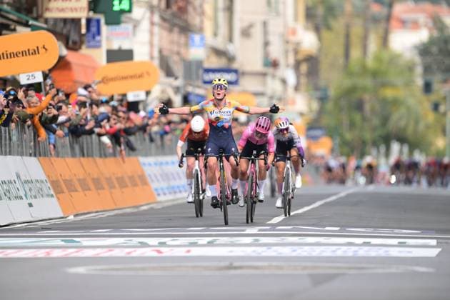 Belgian Lotte Kopecky celebrates as she crosses the finish line to win the Milano-Sanremo one day cycling race for women, 298km from Milan to San Remo, Italy, Saturday 21 March 2026. DAVIDxPINTENS  x168453646x