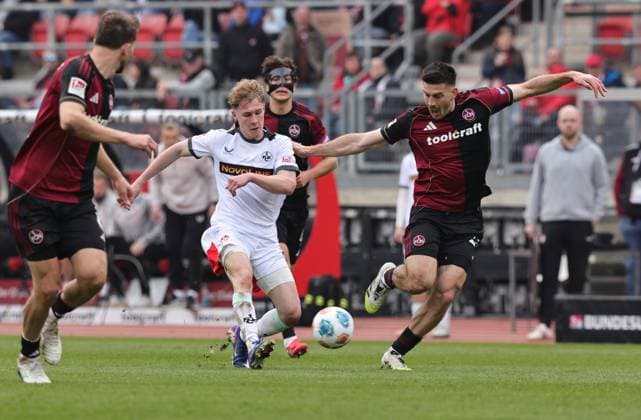 21 03 2026 Soccer Season 2025 2026 2 Soccer Bundesliga 27 Matchday 1 FC Nürnberg FCN Club 1 FC Kaiserslautern FCK Rote Roten Teufel Sportfoto Zink DaMa xdaxmax DFL regulations prohibit any use of photographs as image sequences and or quasi video only for editorial use Mika Haas 22, 1 FC Kaiserslautern FCK Luka Lochoshvili 24, 1 FC Nürnberg FCN